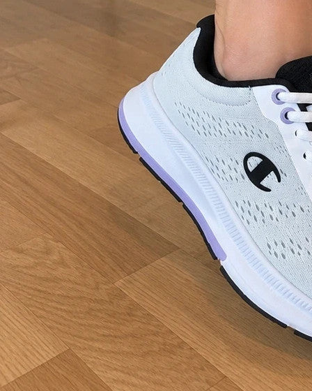 Champion white trainers with black and subtle lilac details, lightweight textile material.