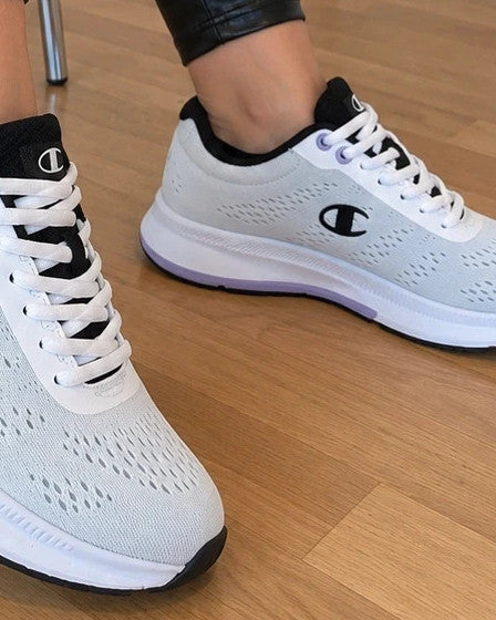 Champion white trainers with black and subtle lilac details, lightweight textile material.