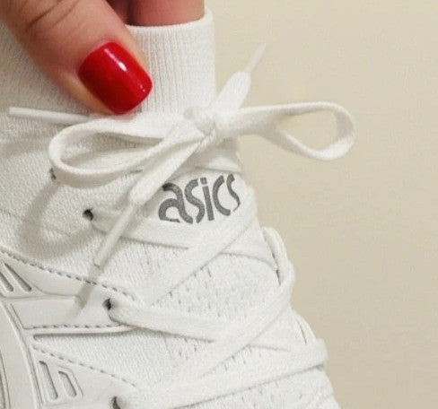 ASICS white trainers synthetic and textile material with classic design and logo.