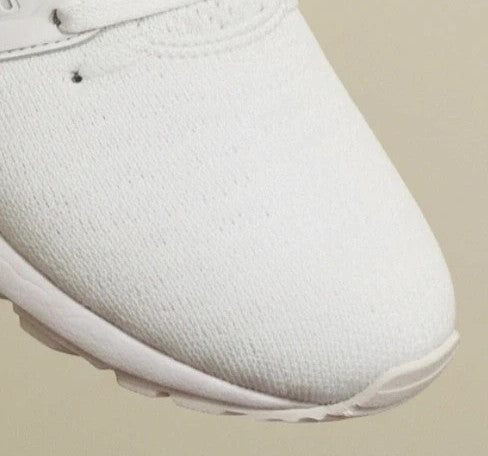 ASICS white trainers synthetic and textile material with classic design and logo.