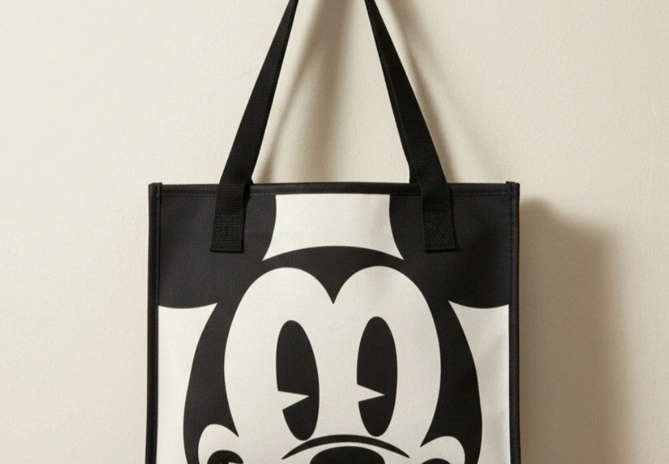 One Size black and cream shopping tote with zipper, synthetic and textile material.