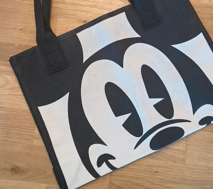 One Size black and cream shopping tote with zipper, synthetic and textile material.