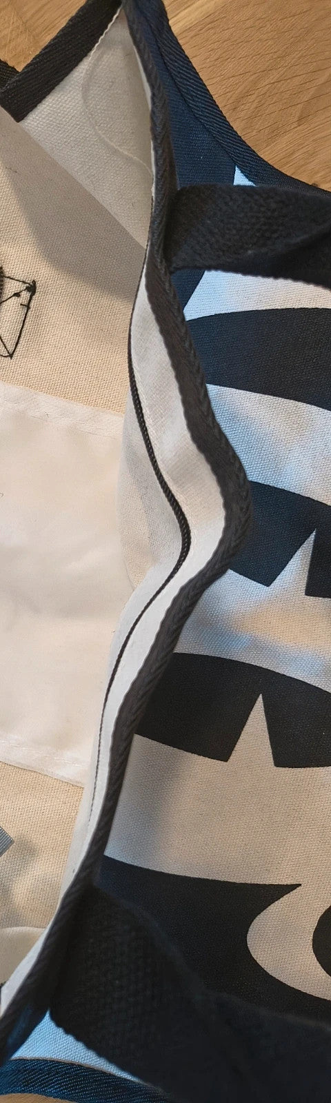 One Size black and cream shopping tote with zipper, synthetic and textile material.