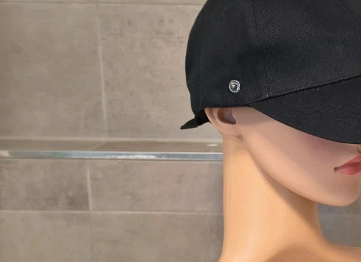 ohne black hat with side snap buttons, minimalist design, adult size