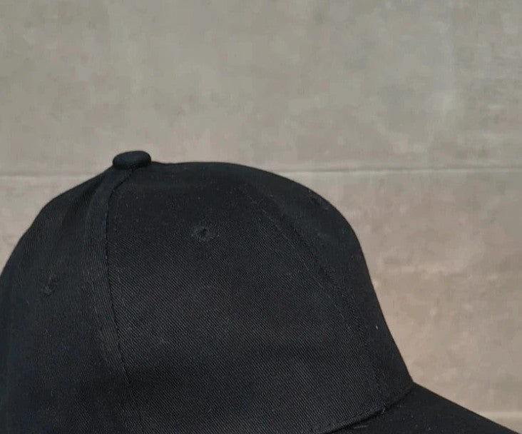 ohne black hat with side snap buttons, minimalist design, adult size