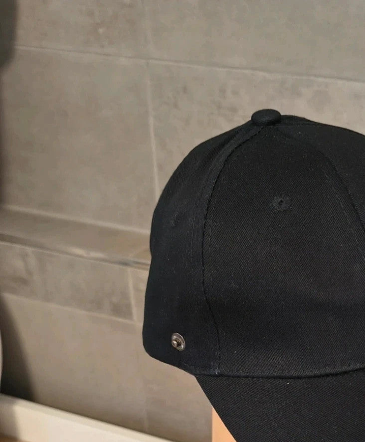 ohne black hat with side snap buttons, minimalist design, adult size