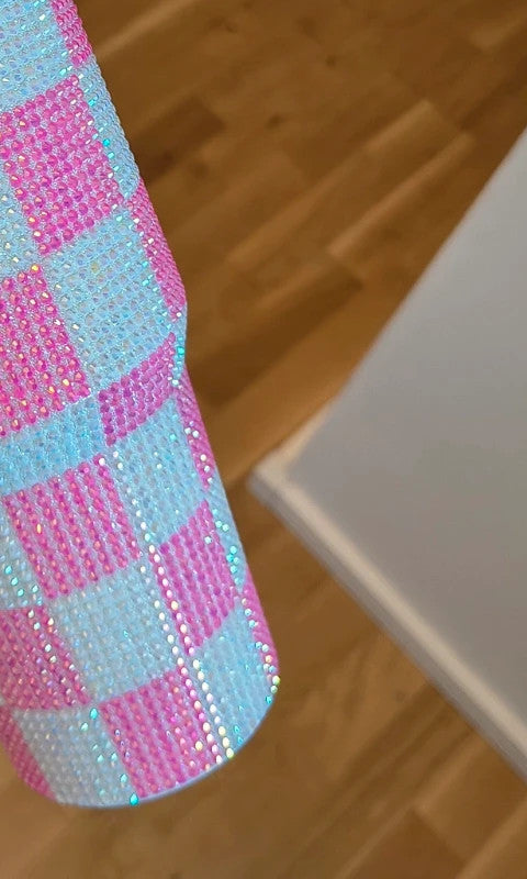 Grosser Isolierbecher pink and white stainless steel thermos with glitter finish.