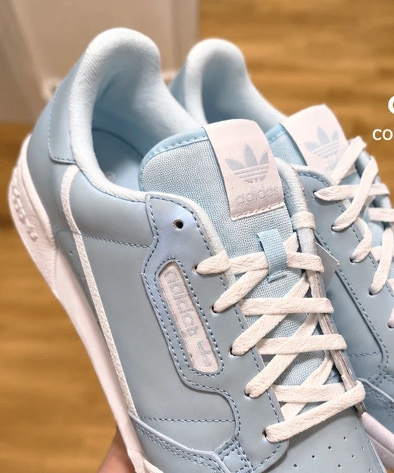 Adidas trainers blue with white details, classic look, subtle logo, size 40.