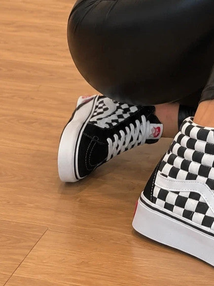 VANS trainers black and white checkered leather high-top with wedge heel and logo.