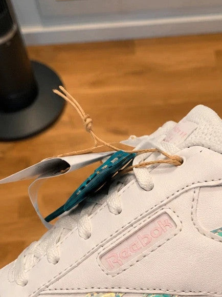 Reebok white trainers with iridescent accents and logo, synthetic material, size 36.
