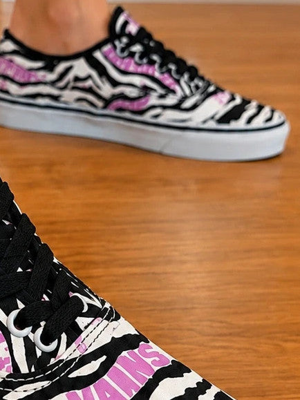 VANS trainers black white zebra print with pink logo and black laces.
