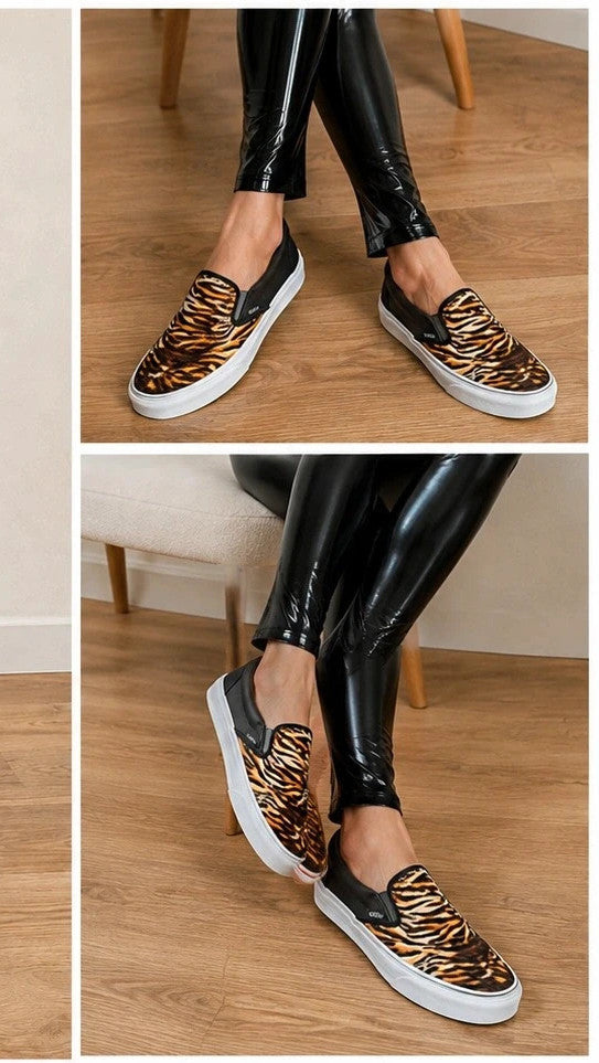 VANS Classic Slip-On sneakers black and brown soft suede with tiger pattern and white sole.
