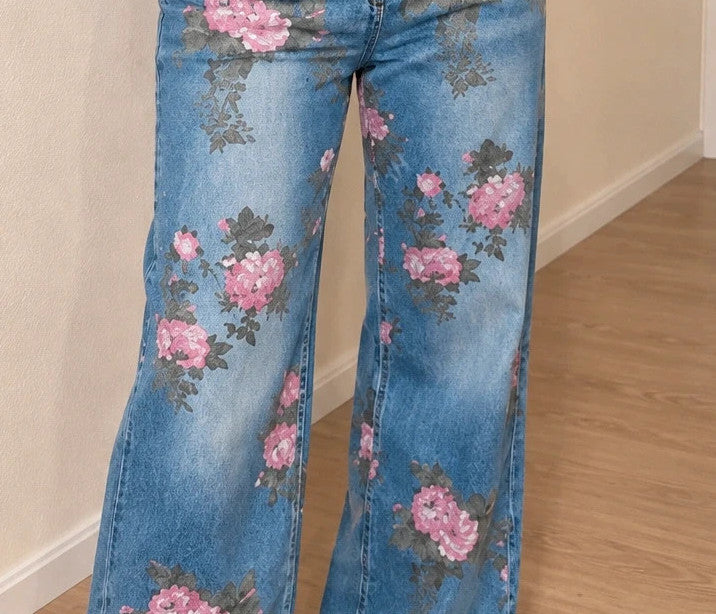 REI blue straight jeans with pink floral pattern and classic button closure.