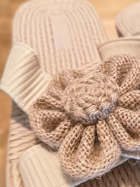 ALS beige slides synthetic material with subtle logo detailing.