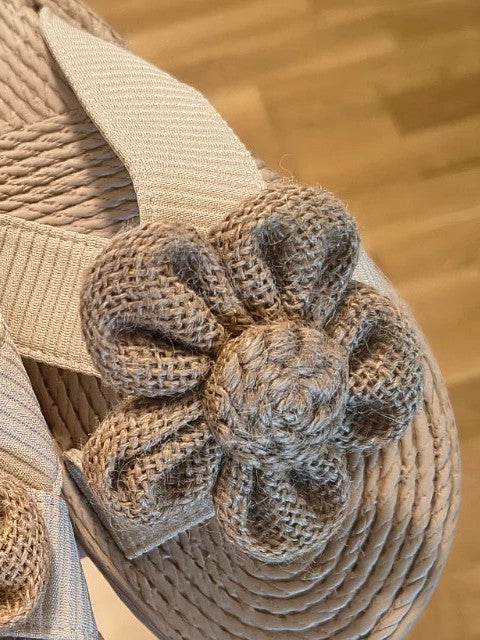 ALS beige slides synthetic material with subtle logo detailing.