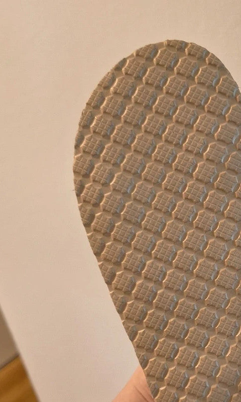 ALS beige slides synthetic material with subtle logo detailing.