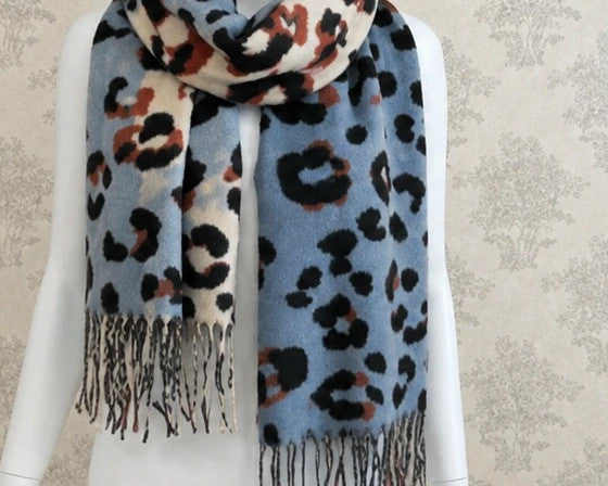 XXL multi shawl with leopard print in light blue, cream, and rust, featuring fringes.