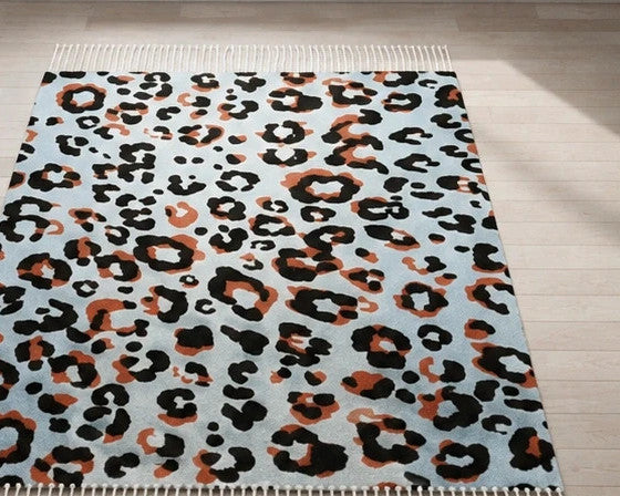XXL multi shawl with leopard print in light blue, cream, and rust, featuring fringes.