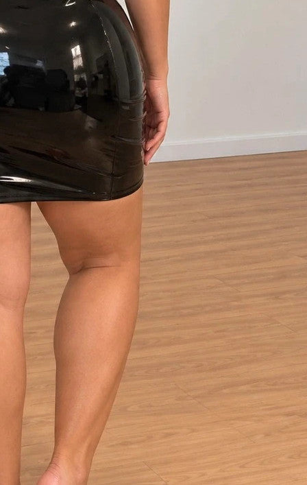 REI black bandage dress with shiny wetlook finish and adjustable spaghetti straps.