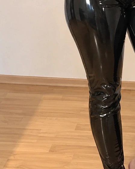 Silhouette black wetlook jumpsuit high waist with front zipper and glossy finish.