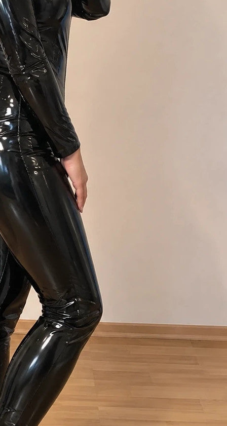 Silhouette black wetlook jumpsuit high waist with front zipper and glossy finish.