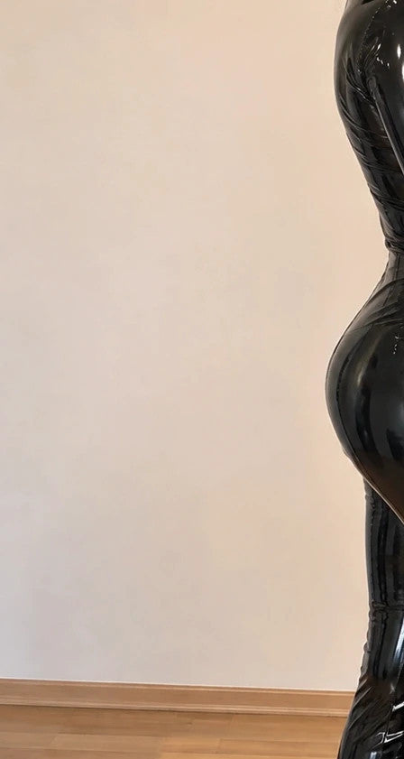 Silhouette black wetlook jumpsuit high waist with front zipper and glossy finish.