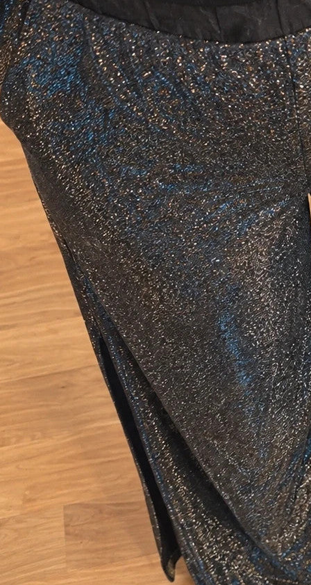 SheIn black and silver glitter flared pants with side slits and shimmering fabric.