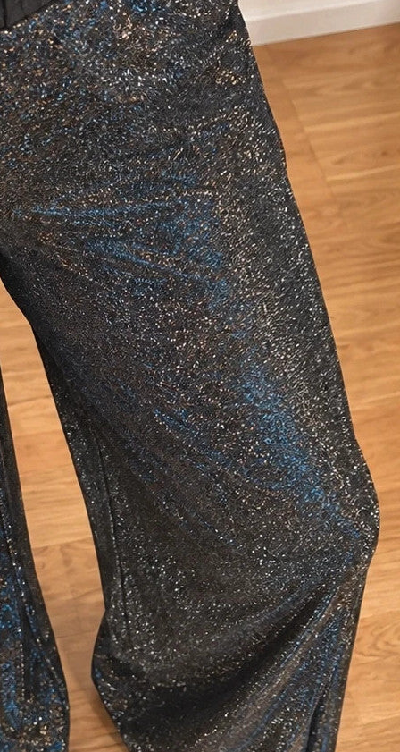 SheIn black and silver glitter flared pants with side slits and shimmering fabric.