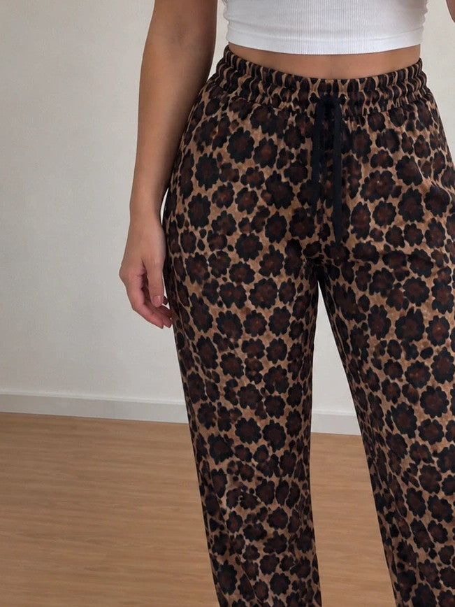 SheIn joggers black and brown leopard print, elastic waistband, lightweight synthetic material.