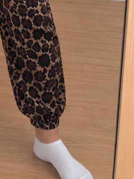 SheIn joggers black and brown leopard print, elastic waistband, lightweight synthetic material.