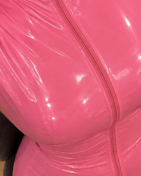 Che pink jumpsuit with glossy finish, long sleeves, and body-hugging fit.