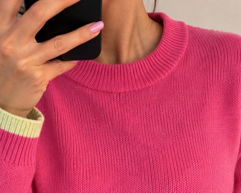 ONLY pink oversized pullover with drawstring, soft material, and contrasting sleeve accents.
