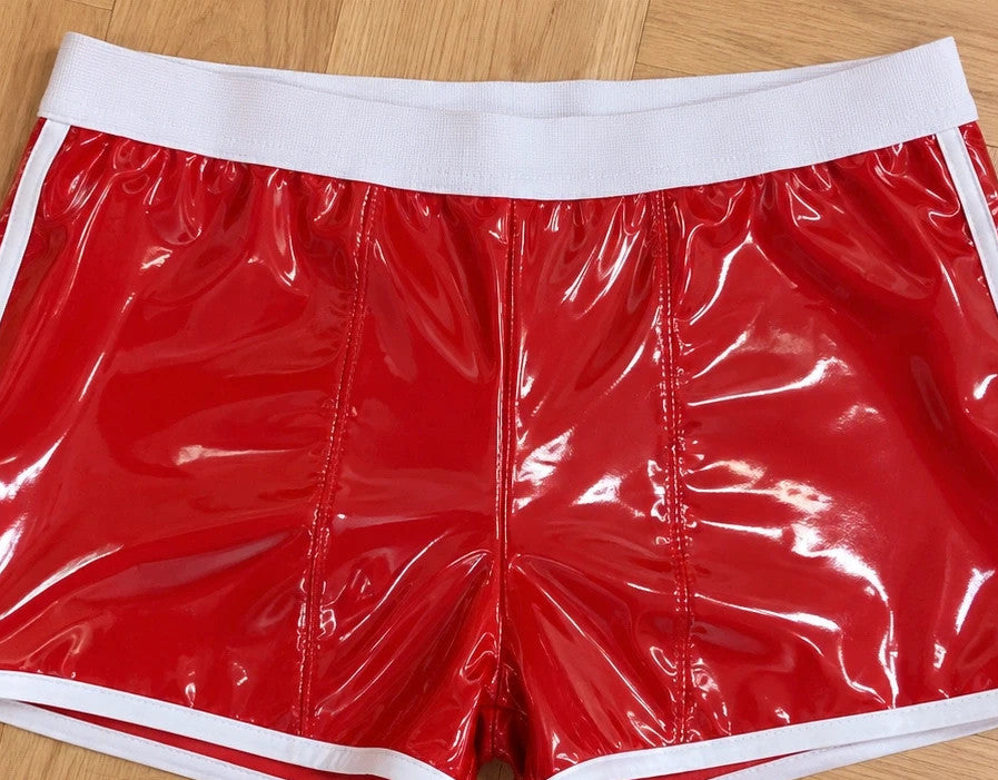 Herren red shorts glossy finish with white contrast details and elastic waistband.