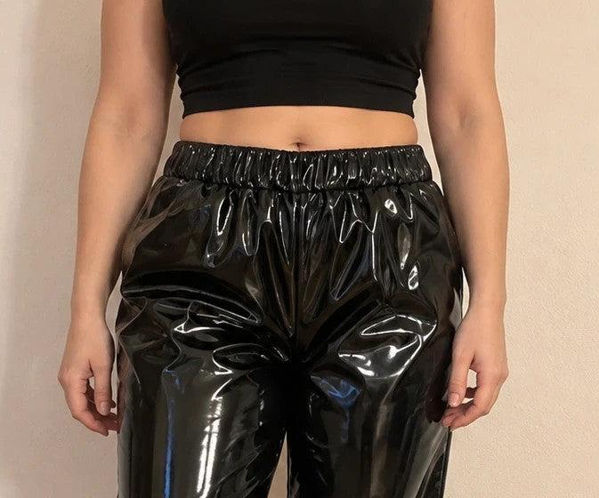 XXL black joggers in shiny wetlook with elastic waistband and cuffs.
