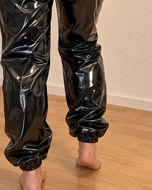 XXL black joggers in shiny wetlook with elastic waistband and cuffs.