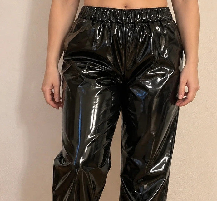 XXL black joggers in shiny wetlook with elastic waistband and cuffs.