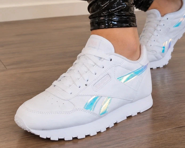 Reebok white trainers hologram details, synthetic material, classic logo design.
