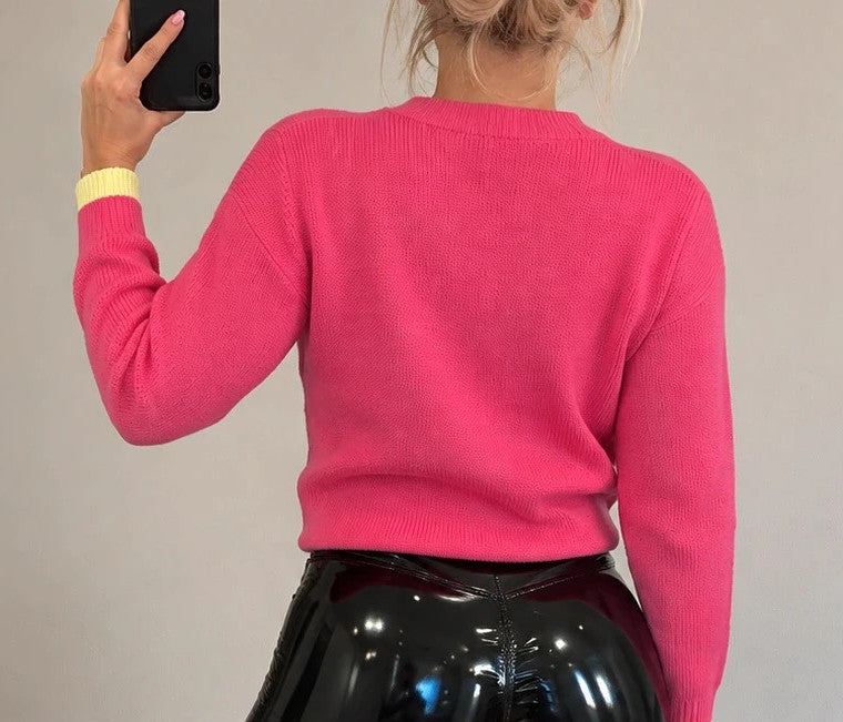 ONLY pink oversized pullover with side lacing and brand label detail.