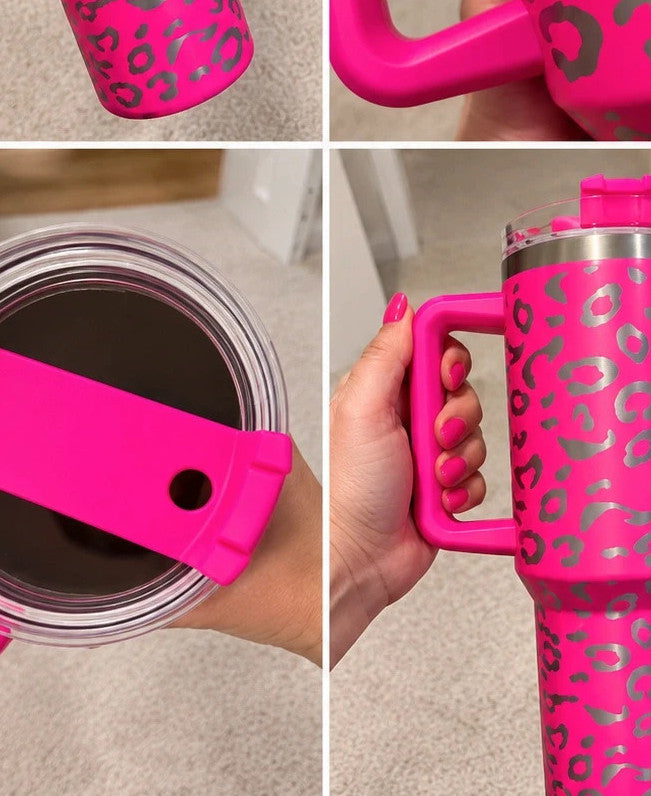 Pink tumbler with leopard print design, insulated, featuring handle and matching lid.