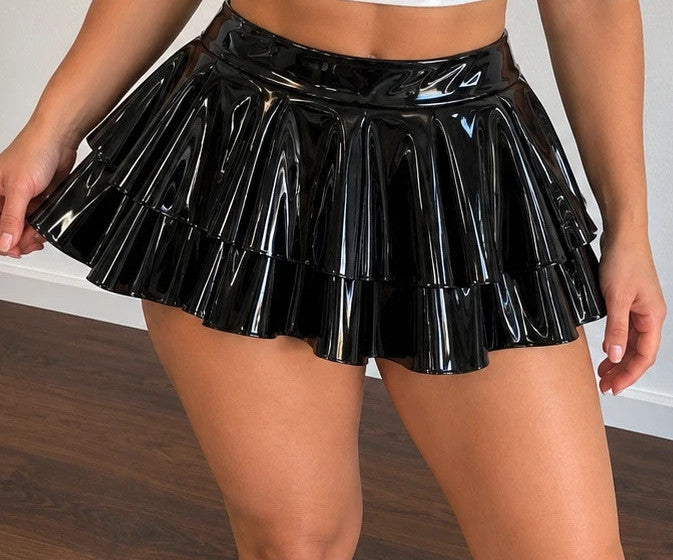 XXL black wetlook ruffled skirt with shiny finish and wide waistband.