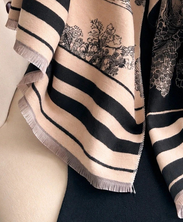 XXL beige and black reversible shawl with beautiful pattern and soft polyester material.