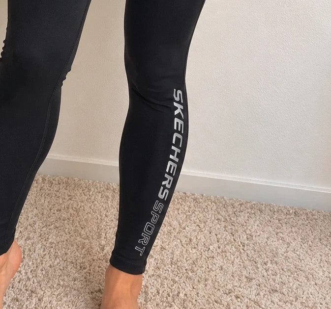 Skechers black bicycle tights high waist with matte finish and logo detail on leg.