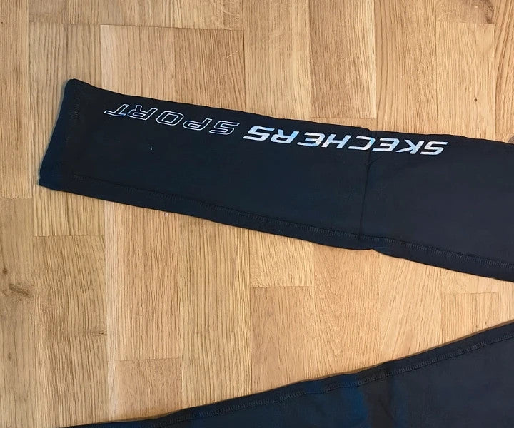 Skechers black bicycle tights high waist with matte finish and logo detail on leg.