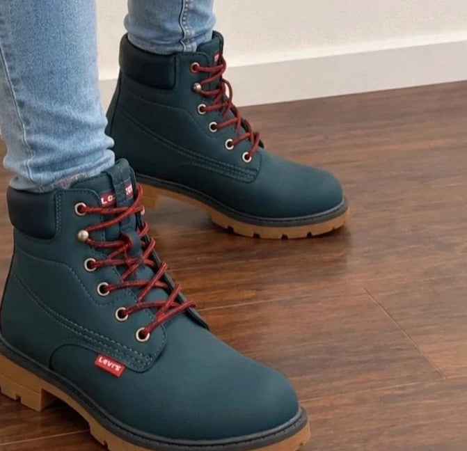 Levi's blue junior boots with contrasting laces, padded shaft, and rugged sole.