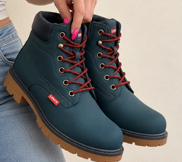 Levi's blue junior boots with contrasting laces, padded shaft, and rugged sole.