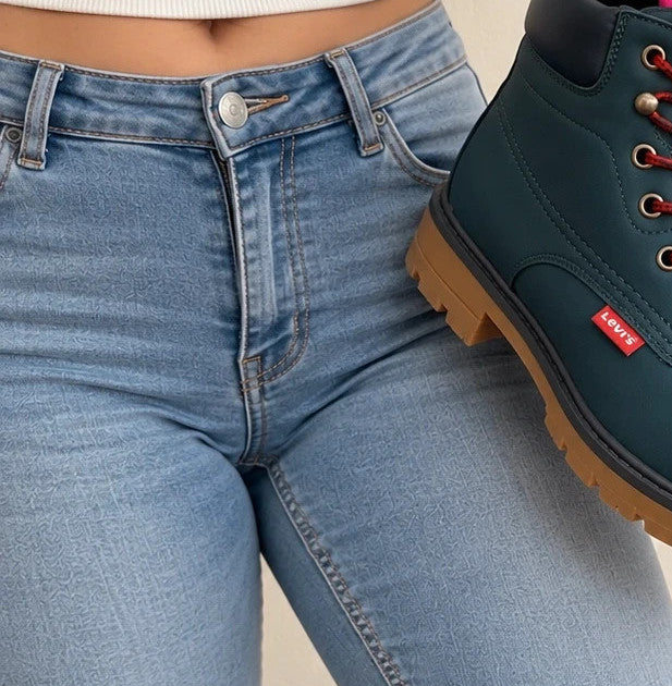 Levi's blue junior boots with contrasting laces, padded shaft, and rugged sole.