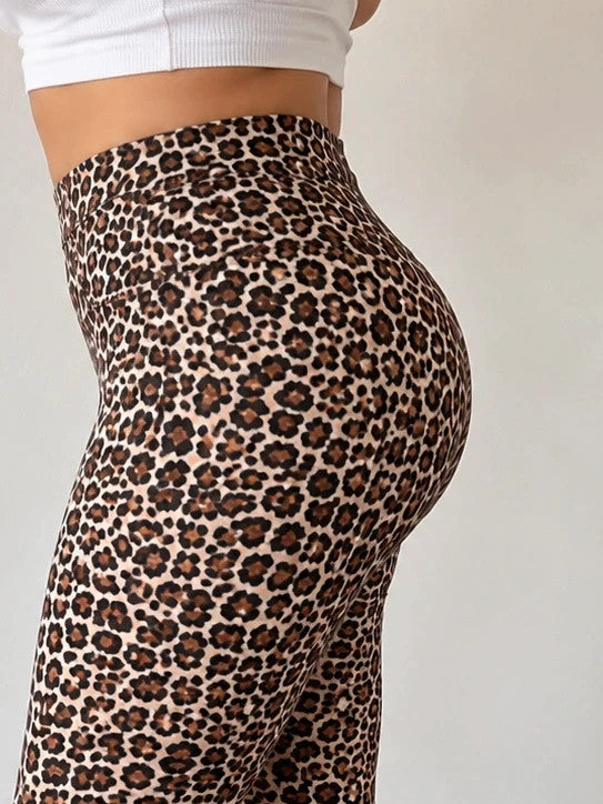 SheIn black and brown leopard print bicycle tights with elastic waistband and fitted design.