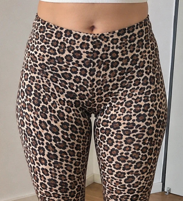 SheIn black and brown leopard print bicycle tights with elastic waistband and fitted design.
