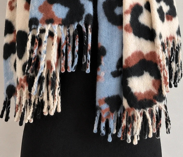 XXL multi shawl featuring plush leopard print in cream, light blue, black, and brown.