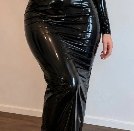 Che black maxi dress, glossy finish, fitted silhouette, long sleeves, high collar.